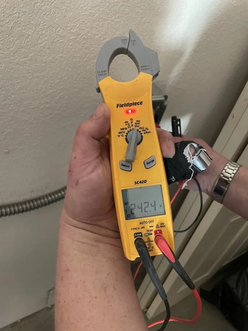 Voltage testing with clamp meter during Generator Installation in Park City